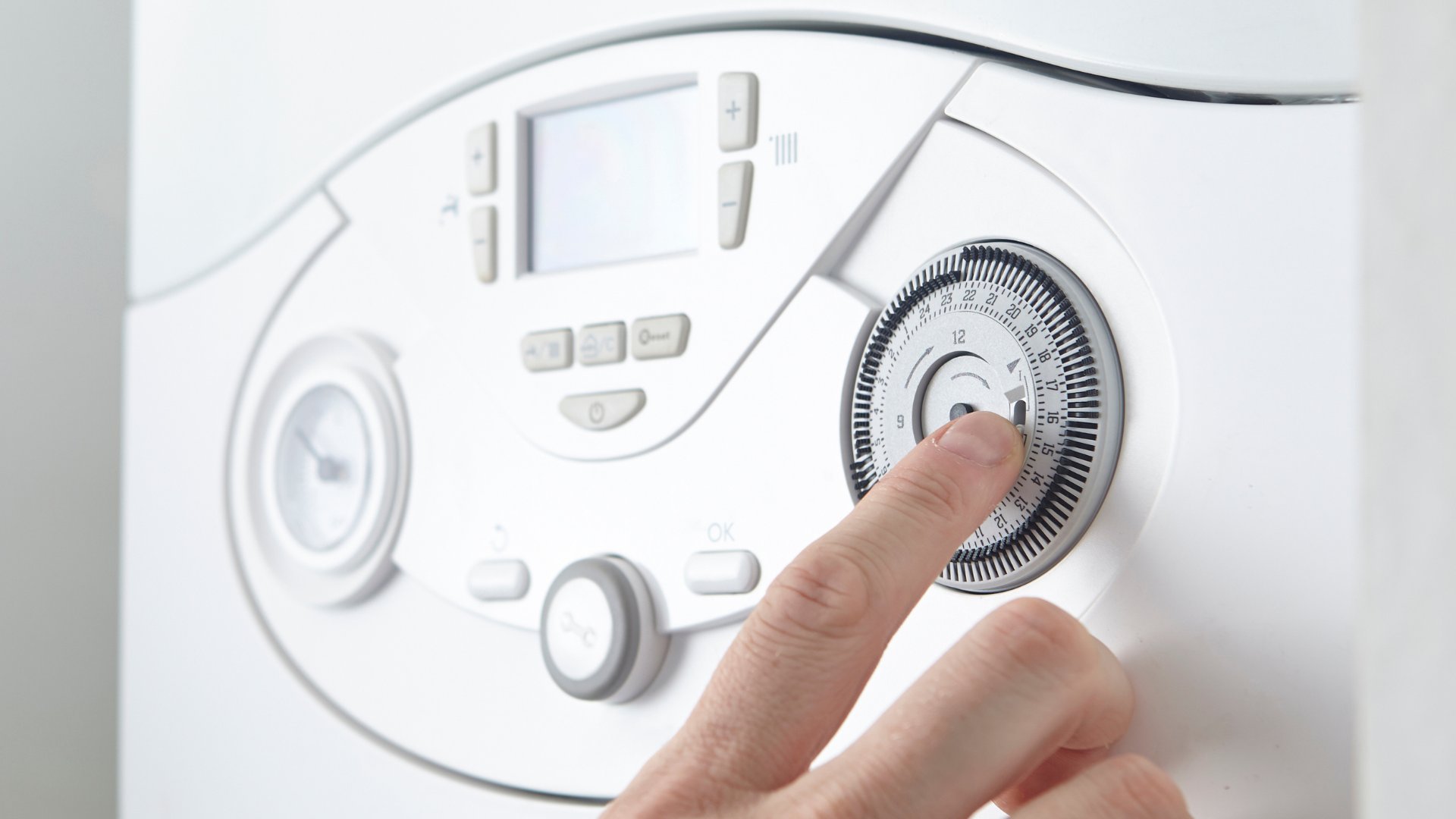 Boiler pressure dial being checked
