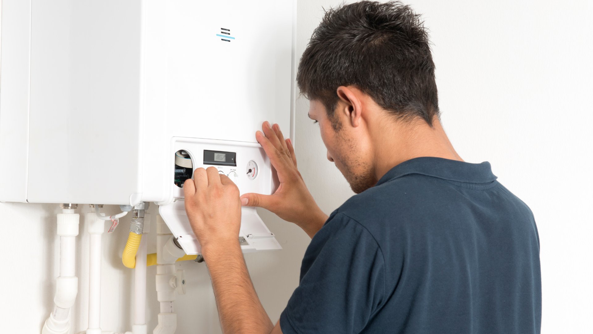 Gas Safe engineer servicing a boiler in Manchester