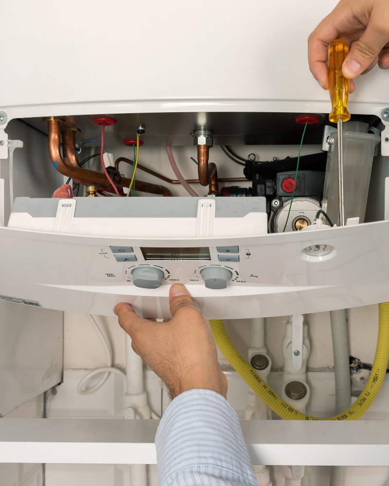Gas Safe engineer checking a boiler in Manchester