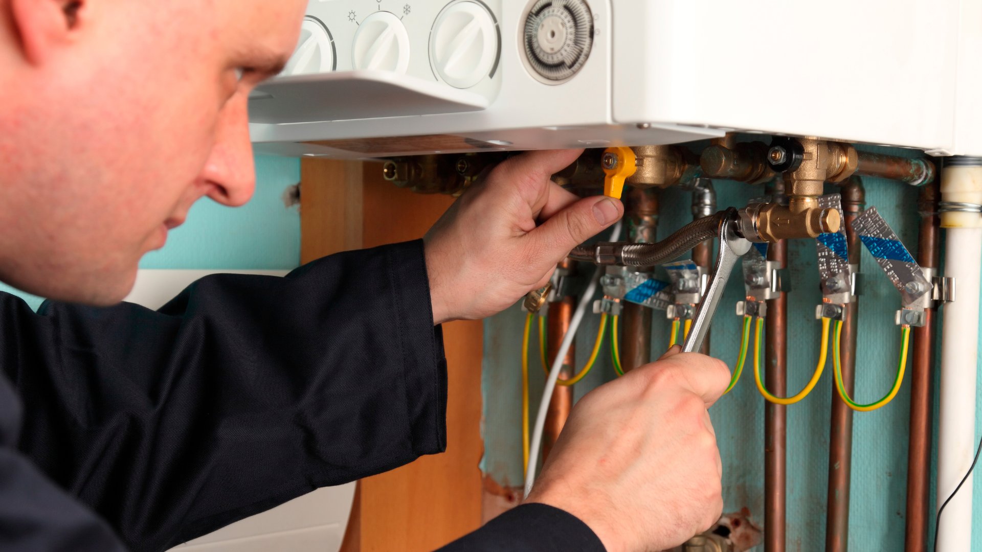 Close-up of a boiler being serviced by a Gas Safe engineer